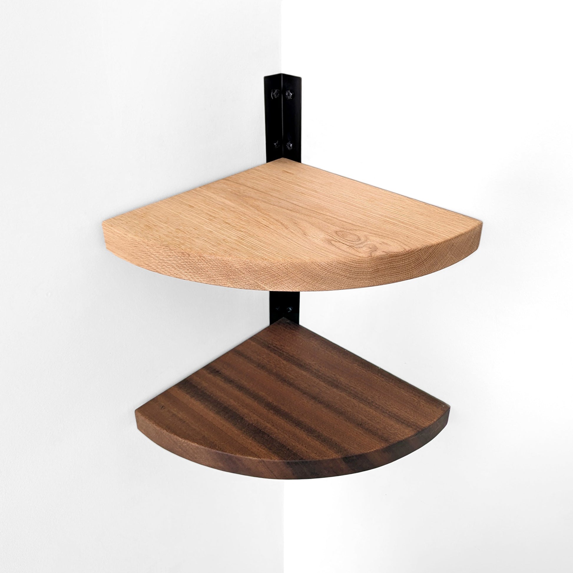 Two wooden corner shelves with black bracket on a white background. Top down view.