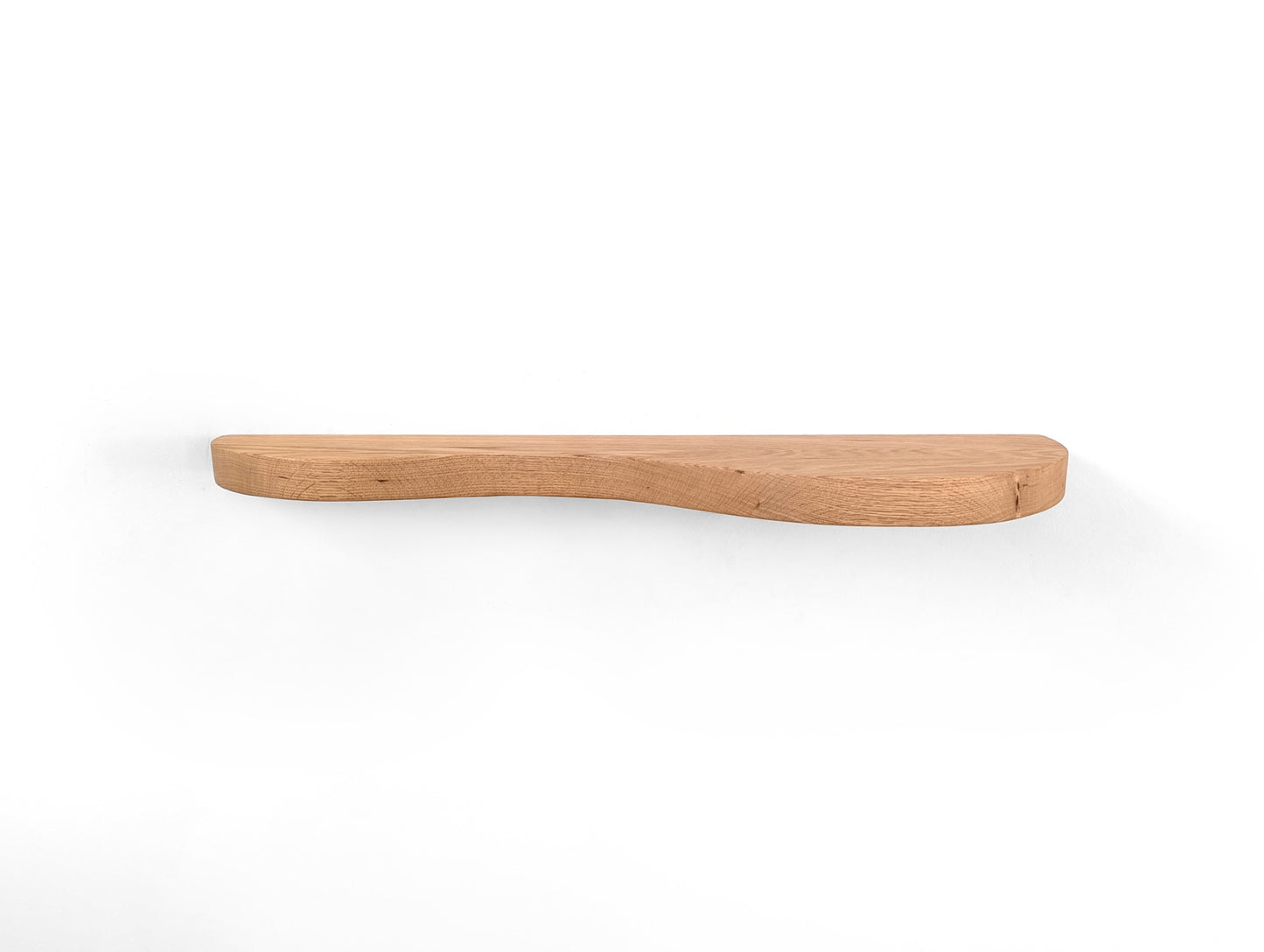An oak double curved floating shelf, photo taken head on