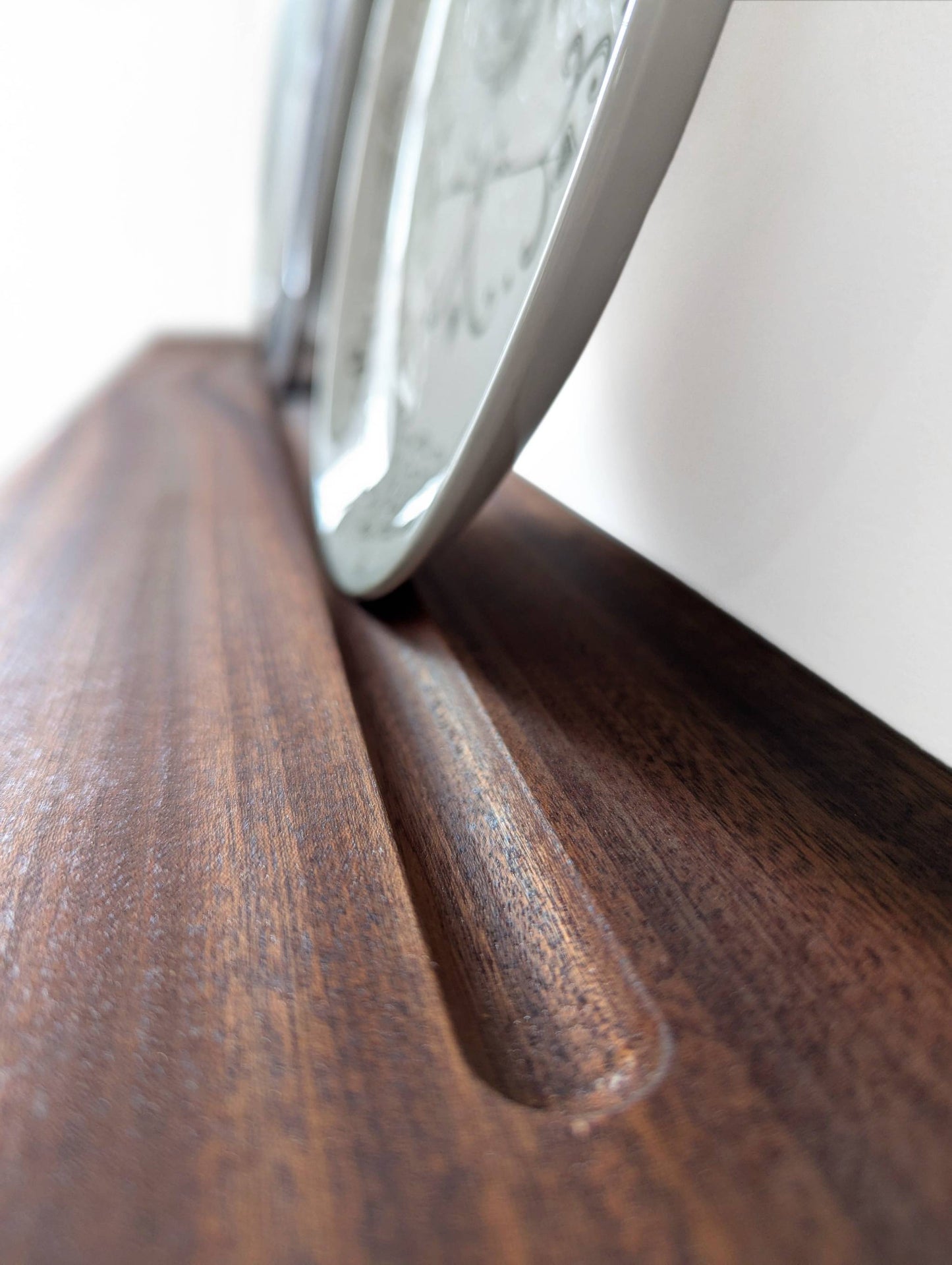 Routed groove on the dish display shelf.
