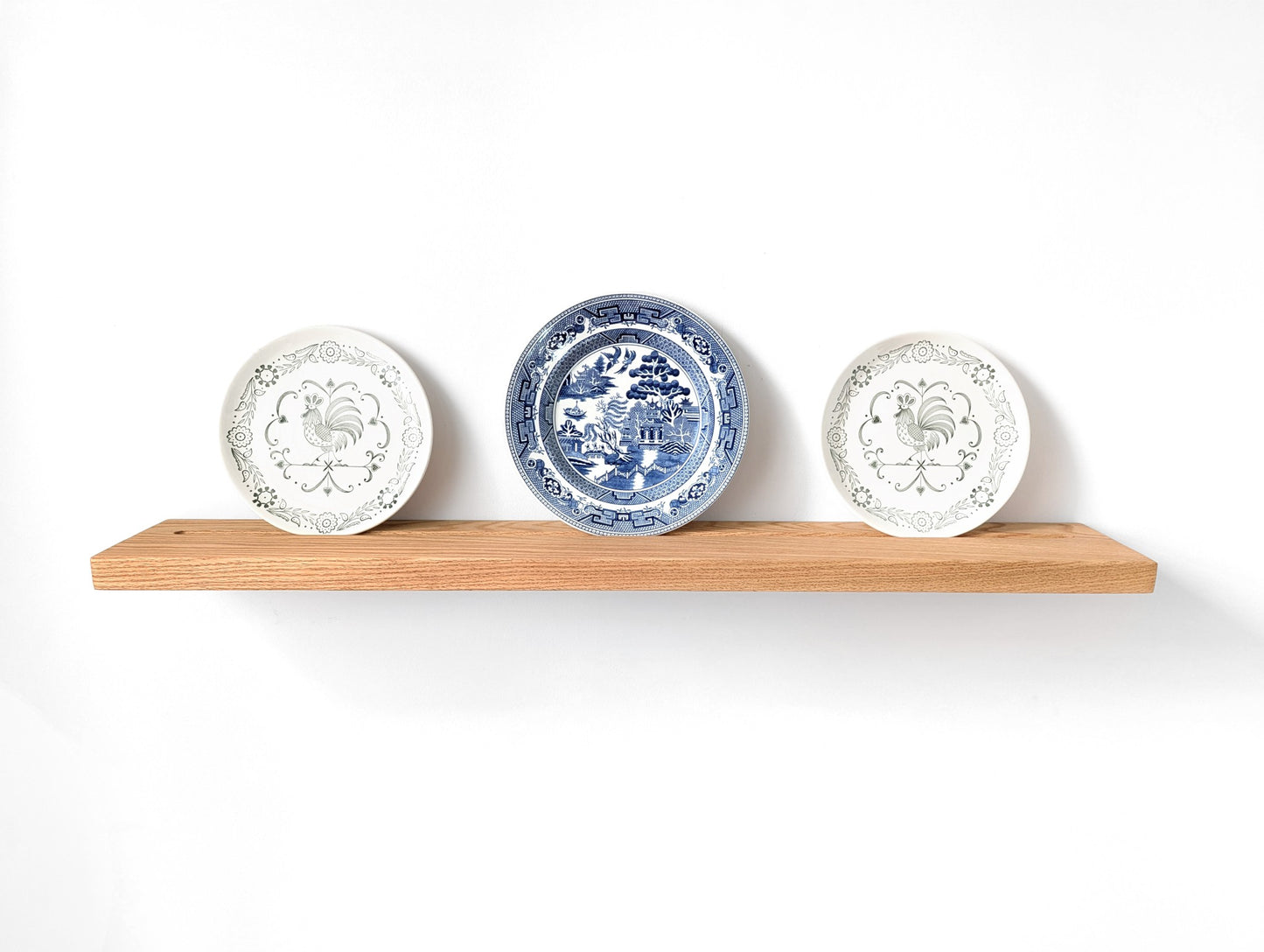 Oak plate display shelf with three decorative shelves.