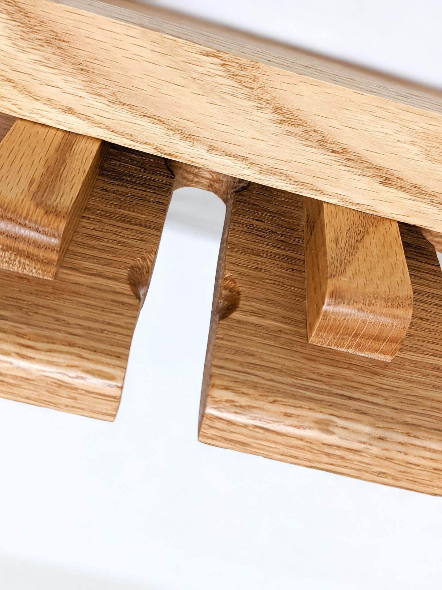A close-up of an individual slot for a tulip beer glass.