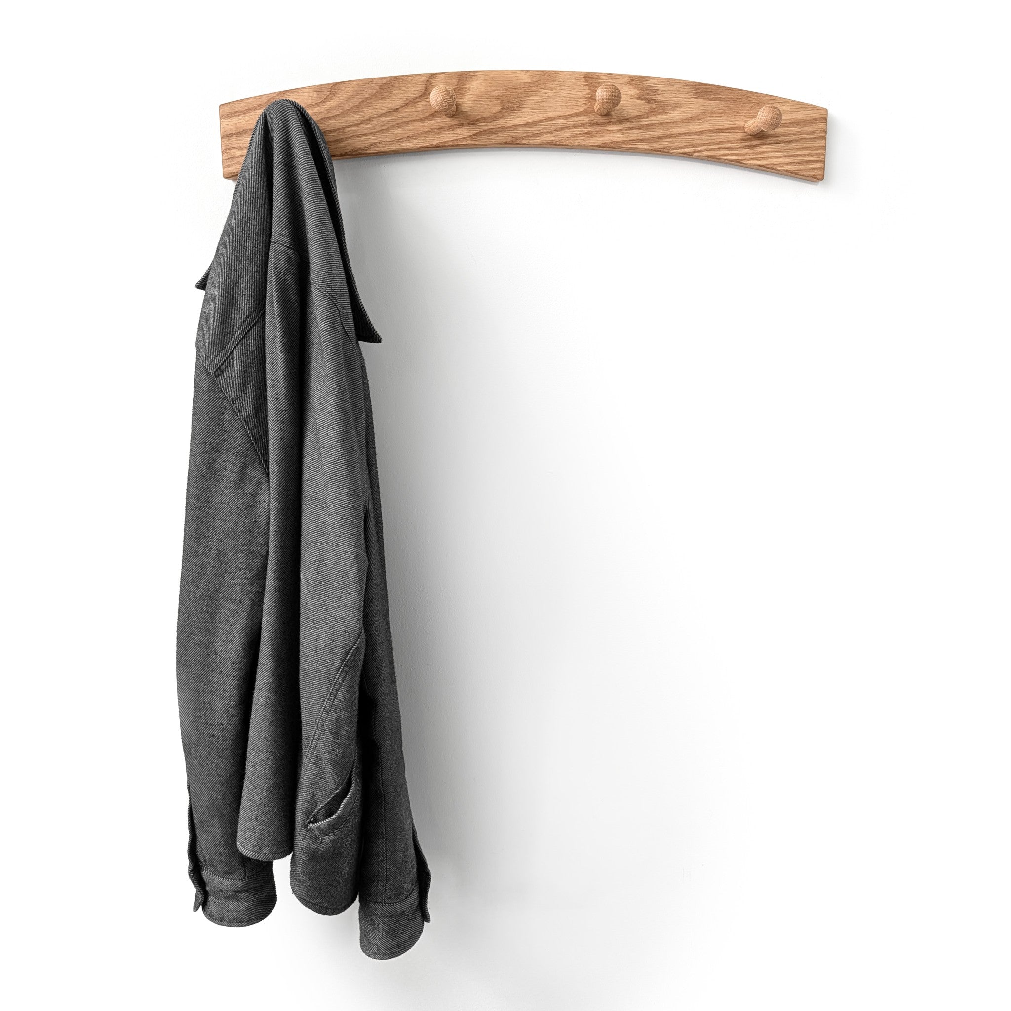 Oak wooden coat rack with a gray jacket on a white background and 6 shaker pegs