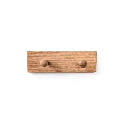 Wooden wall hook with two round hooks on a white background