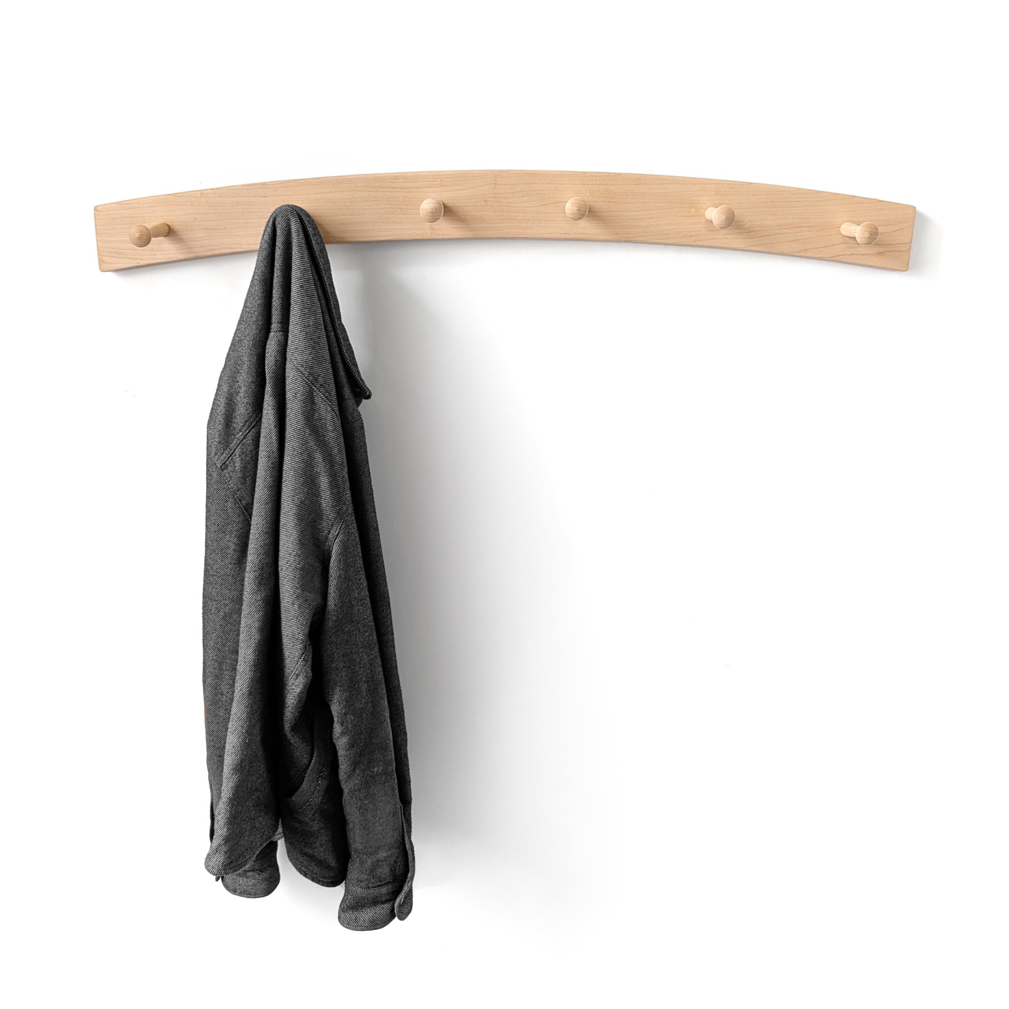 Arch wooden coat rack with a gray spring coat on a white background