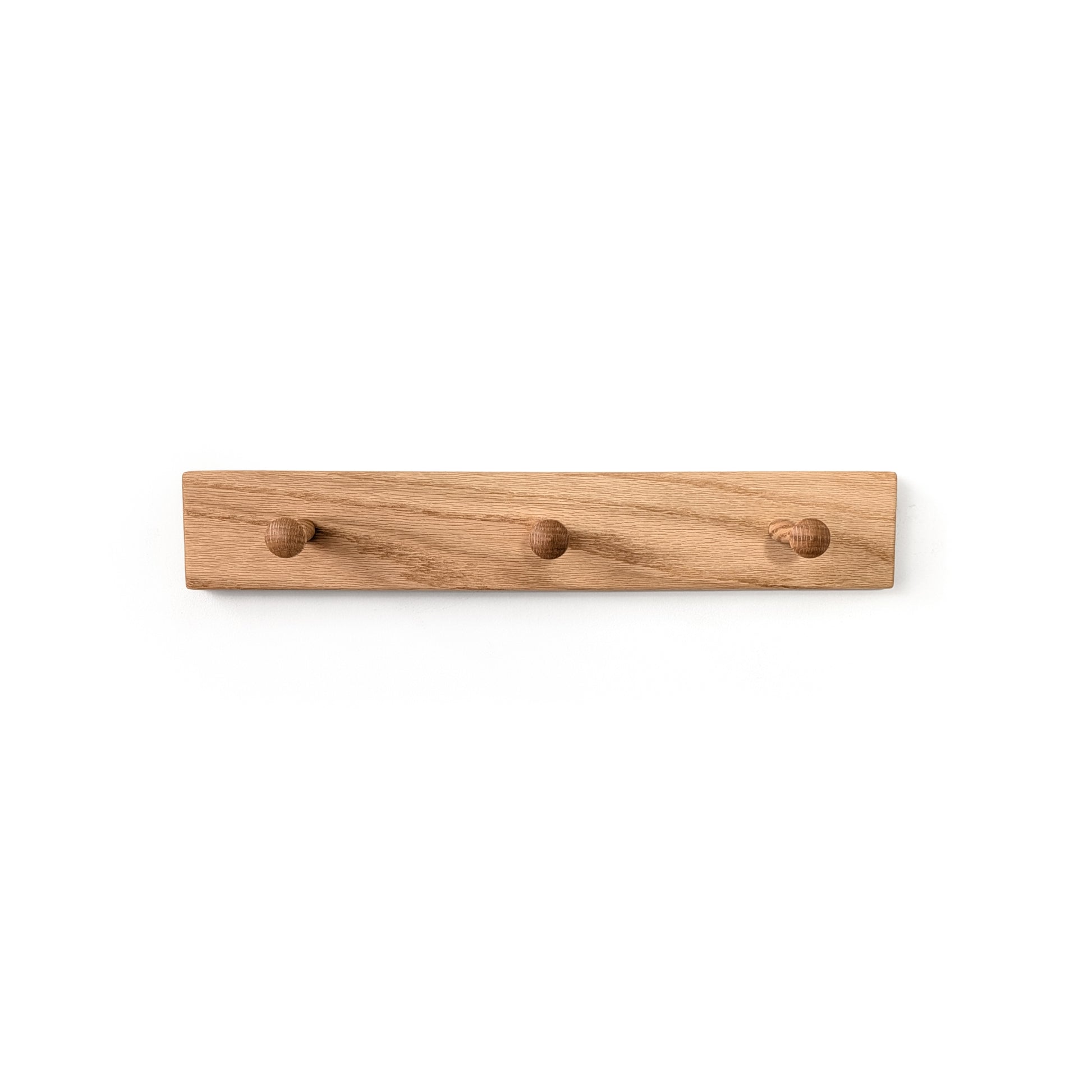 Wooden coat rack with three hooks on a white background