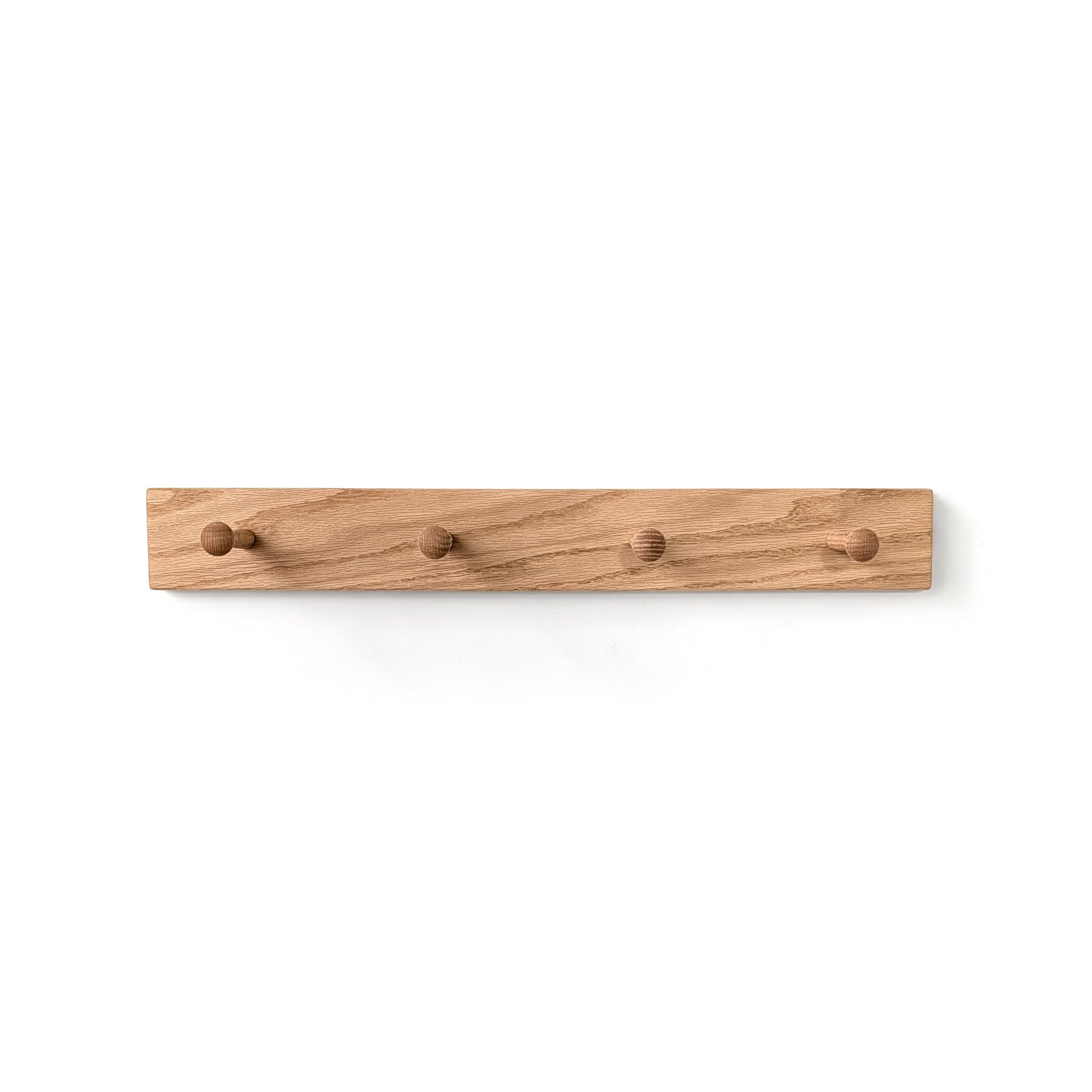 Wooden wall hook with multiple shaker pegs on a white background