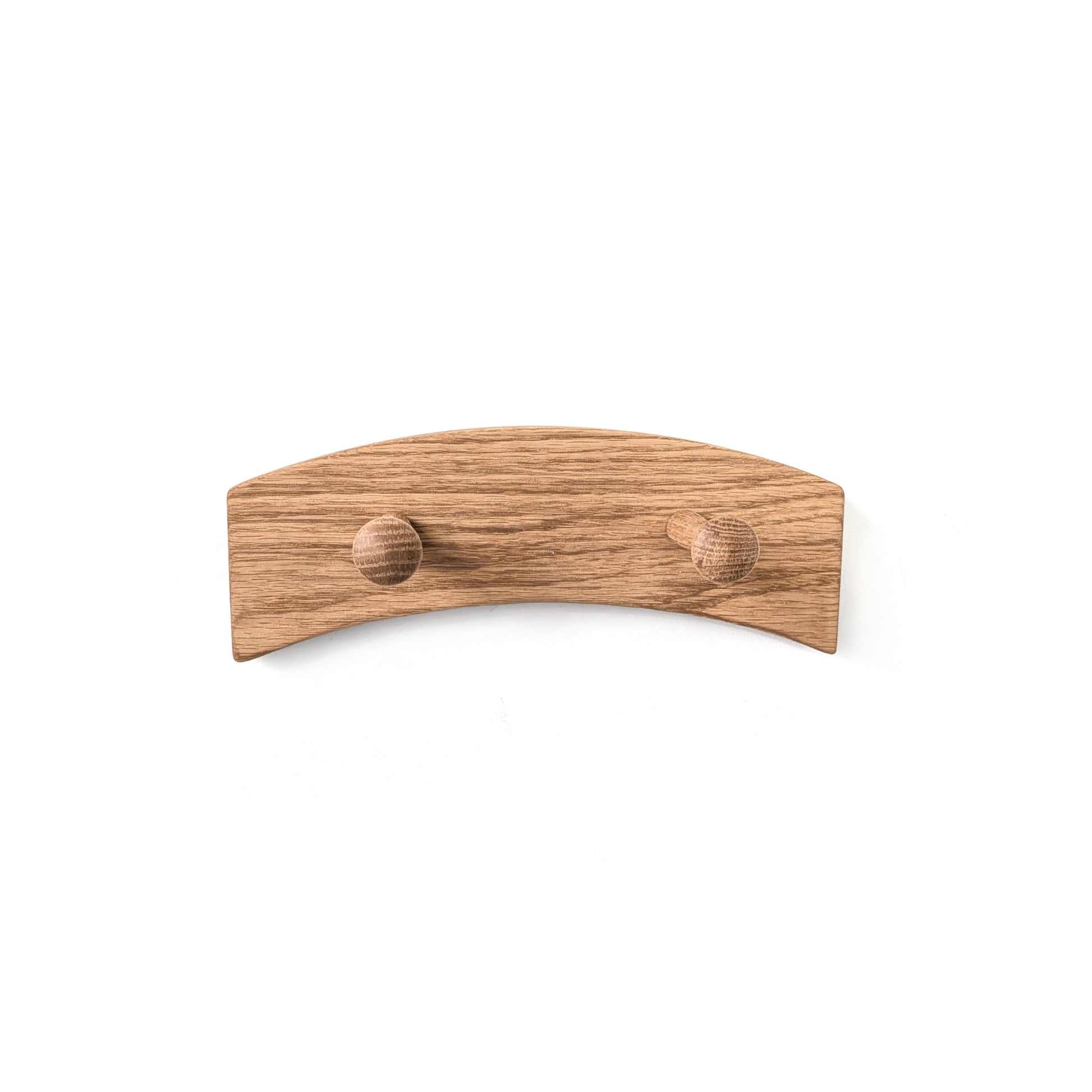 Wooden wall arched coat rack with two pegs on a white background