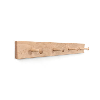 Maple coat rack with four hooks on a white background