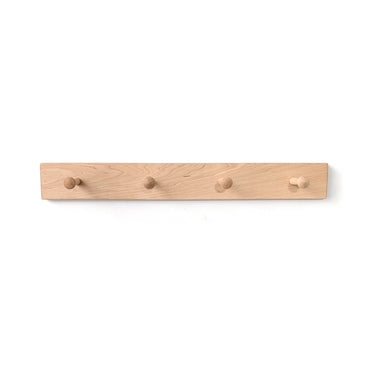 Wooden coat rack with four hooks on a white background