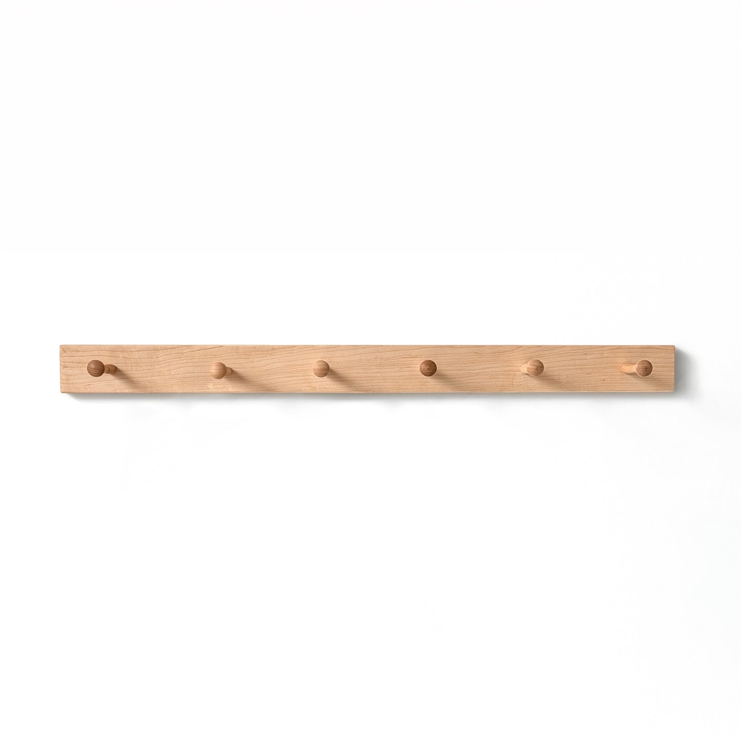 Wooden coat rack with six hooks on a white background