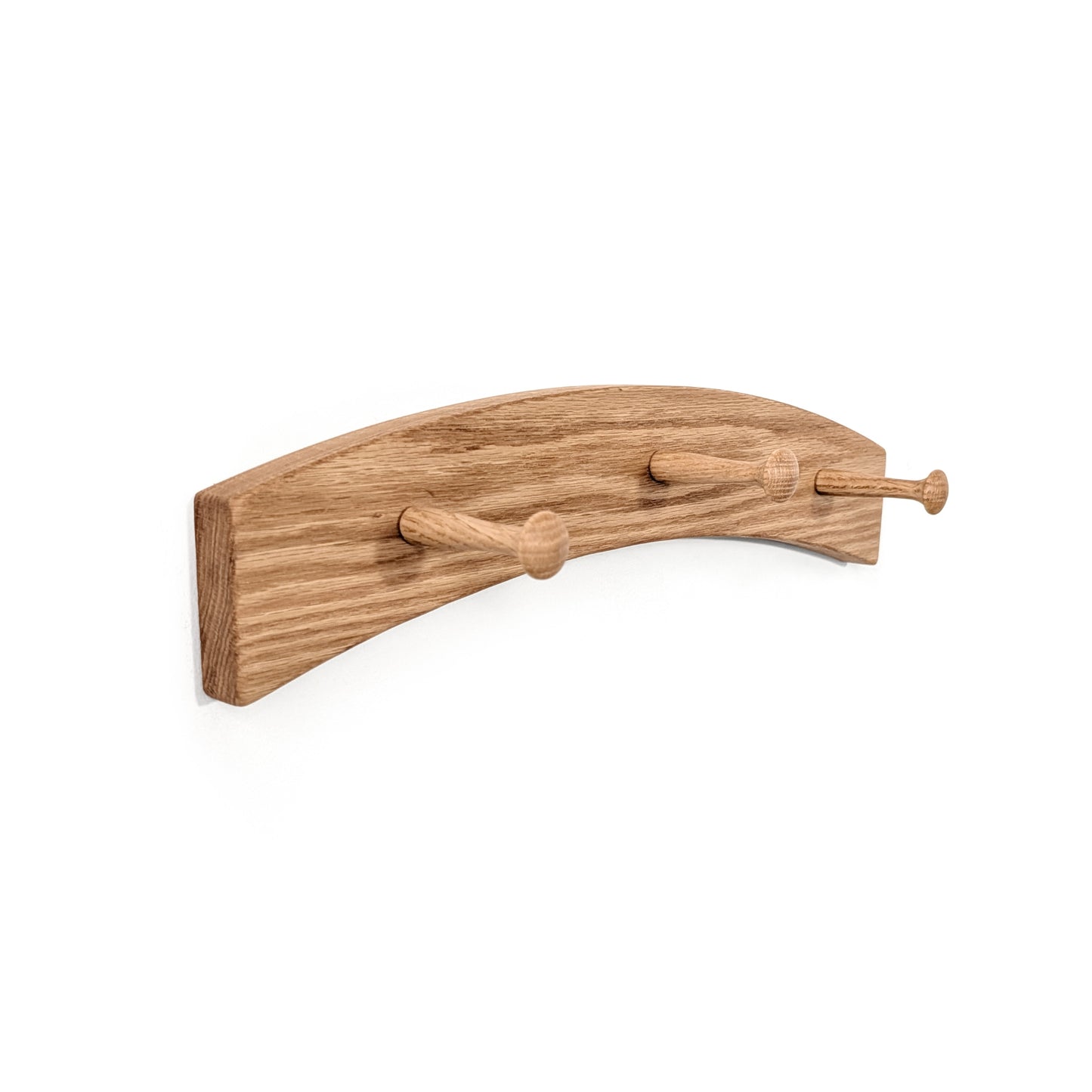Wooden wall coat rack with three hooks on a white background and an arch shape