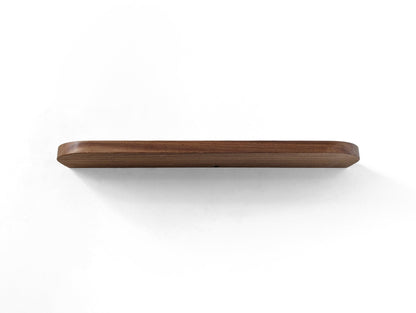 Underneath picture of a mahogany shelf with rounded corners and a cord hole in the center back