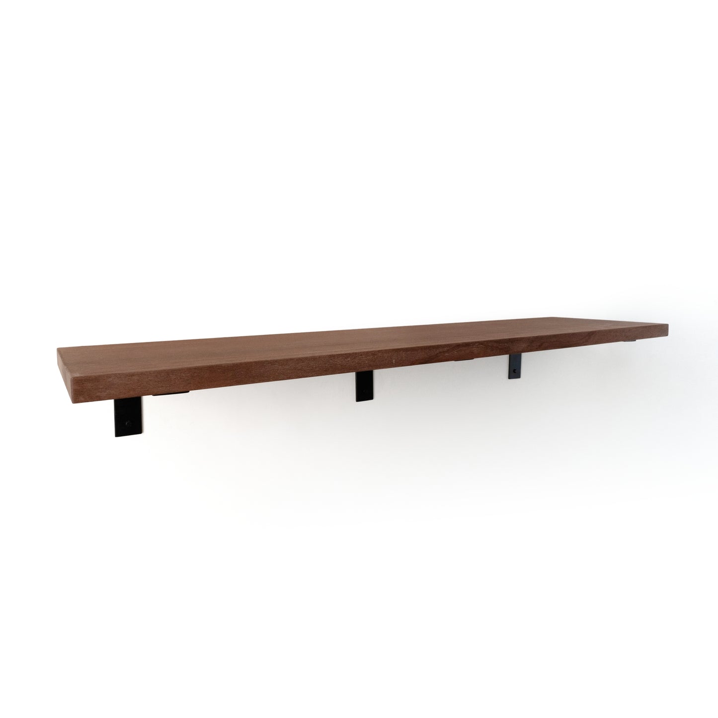 Long wooden shelf with three black L brackets on a white background