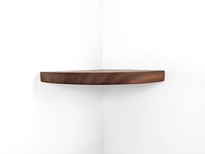 Front view of a thick floating shelf for corners in mahogany