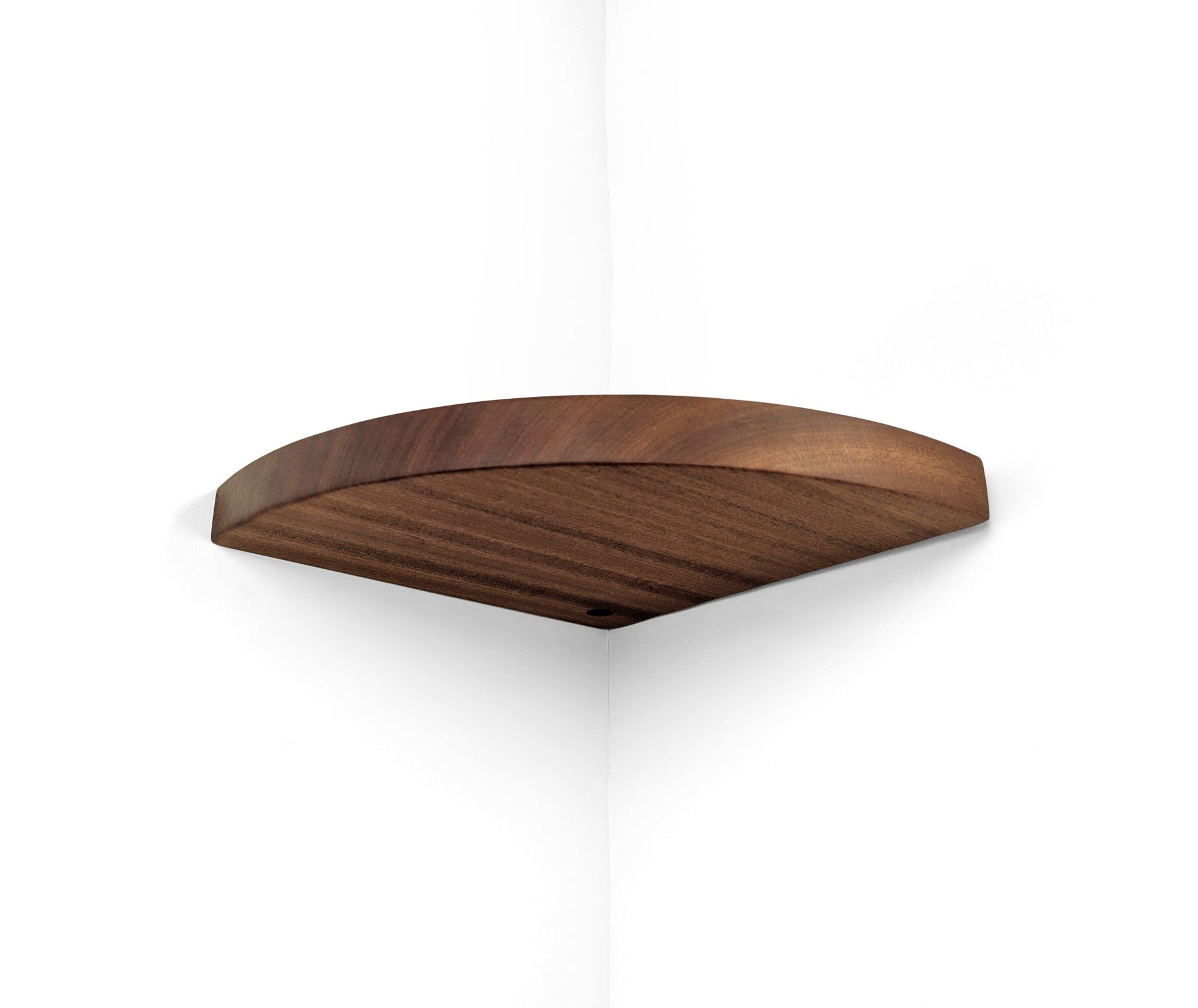 Bottom view of a mahogany corner shelf with a cord hole.