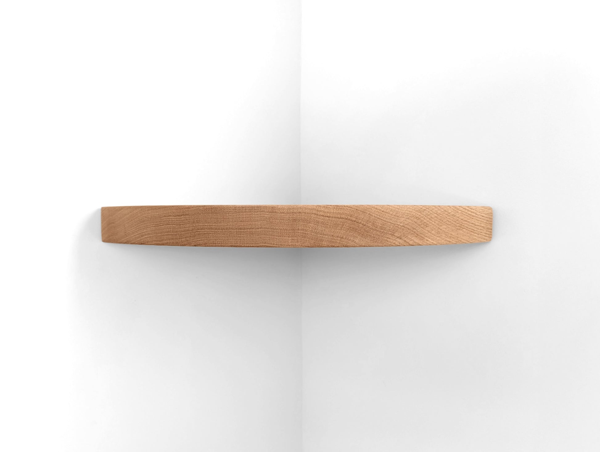 Front view of a thick oak corner floating shelf.