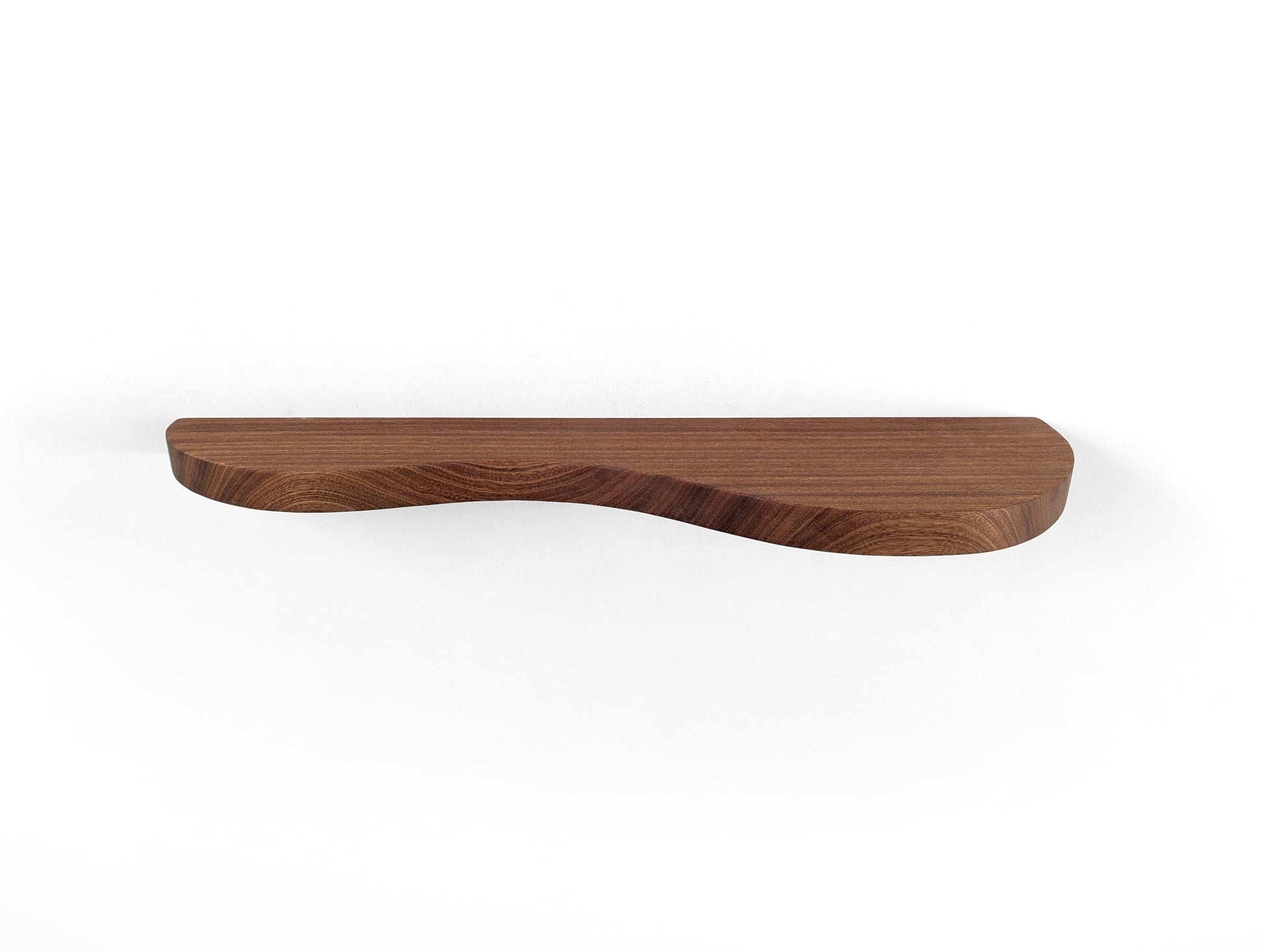A mahogany double curved floating shelf, photo taken head on