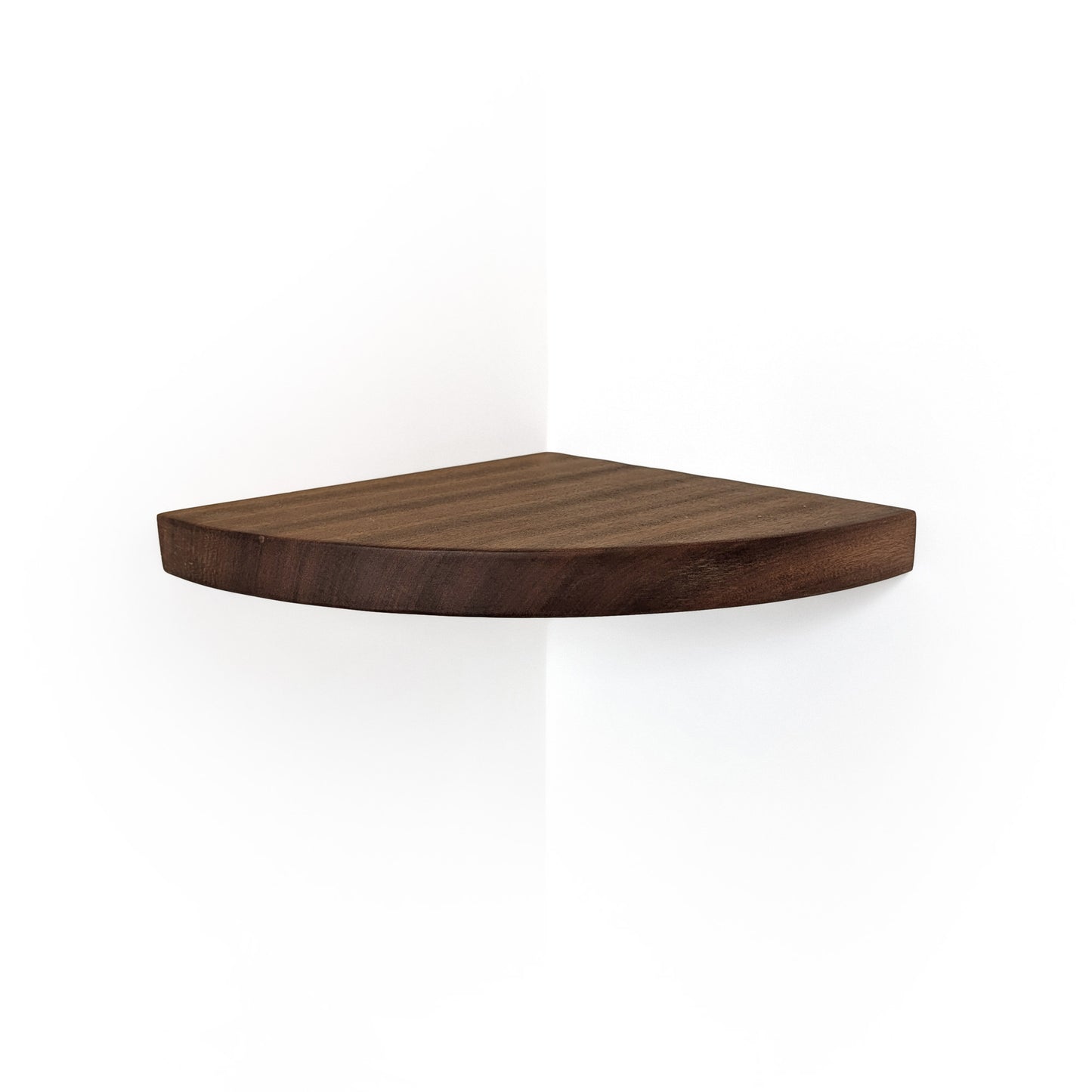 A triangular corner shelf made of dark brown wood, shown mounted on a white wall corner with a soft shadow below.