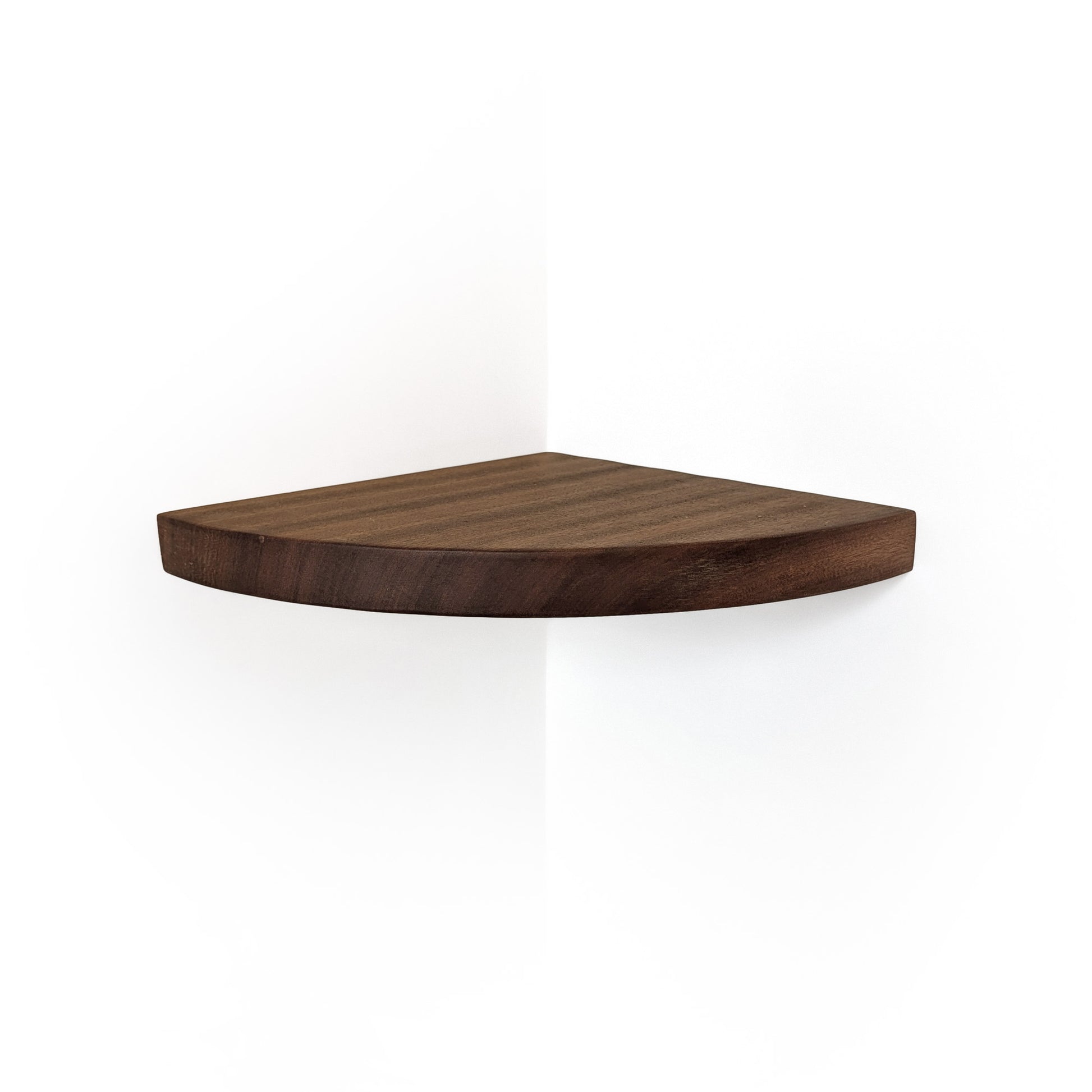 A triangular corner shelf made of dark brown wood, shown mounted on a white wall corner with a soft shadow below.