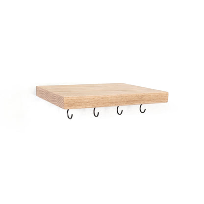 A rectangular light maple wood floating shelf with four black metal wall hooks hanging underneath, shown against a plain white background.
