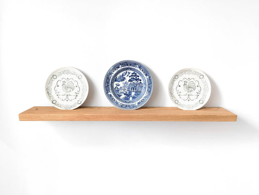 Oak plate display shelf with three decorative shelves.