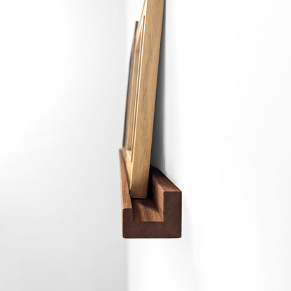 Side view of a mahogany picture ledge
