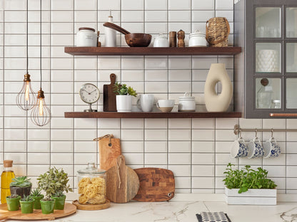 Two thick floating mahogany shelves in a modern kitchen.