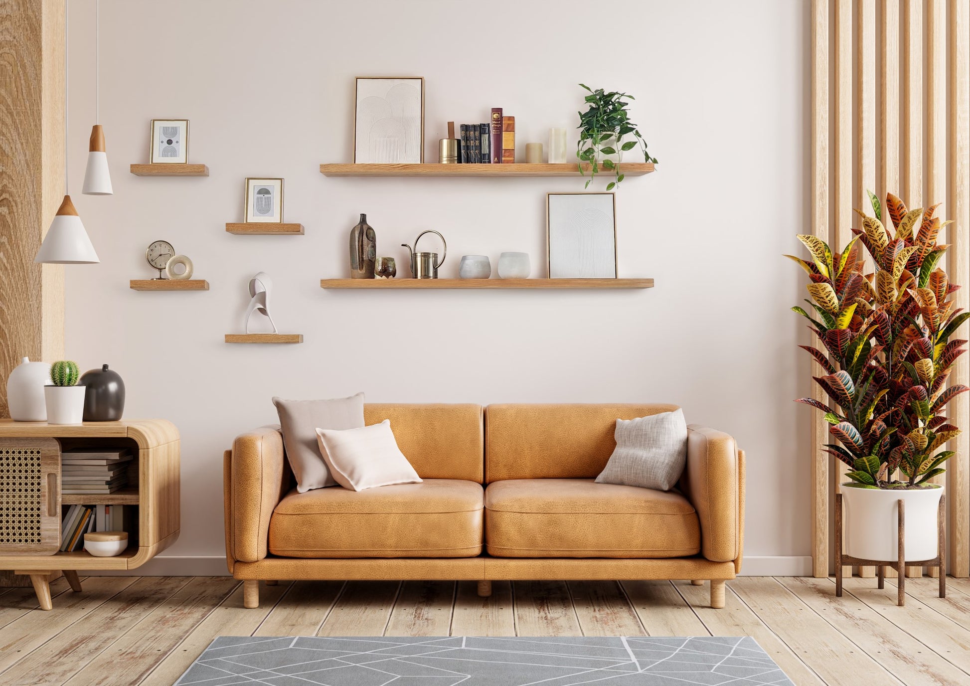 Oak floating shelves installed on a living room wall above a couch.