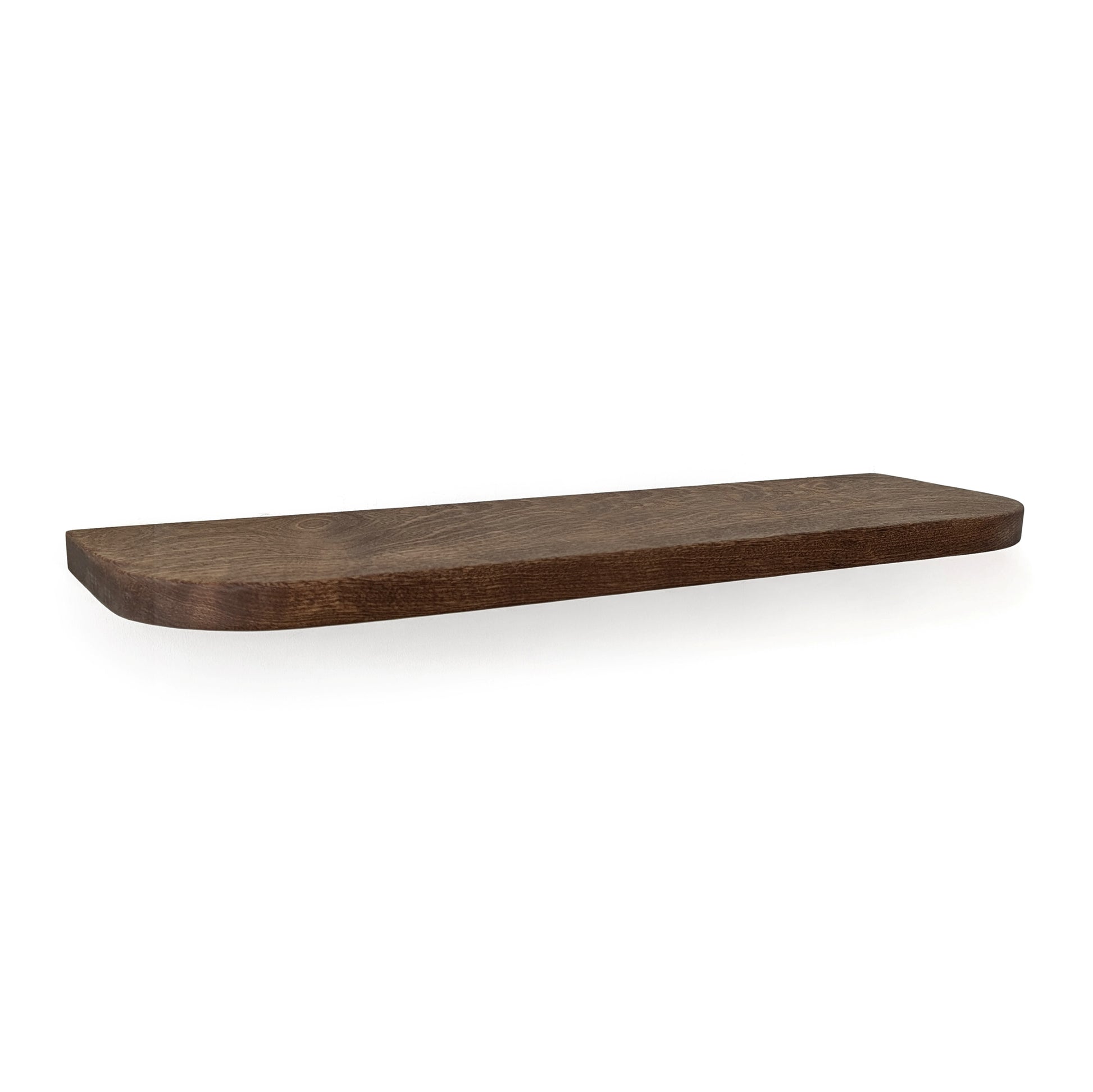 Thick mahogany shelf with walnut stain and rounded corners on a white wall.