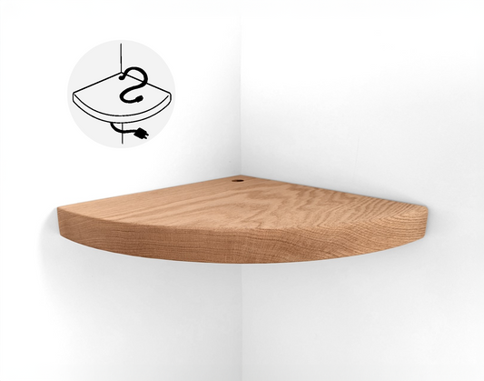 Thick oak floating shelf with a cord hole for wall corners is installed on a white wall.