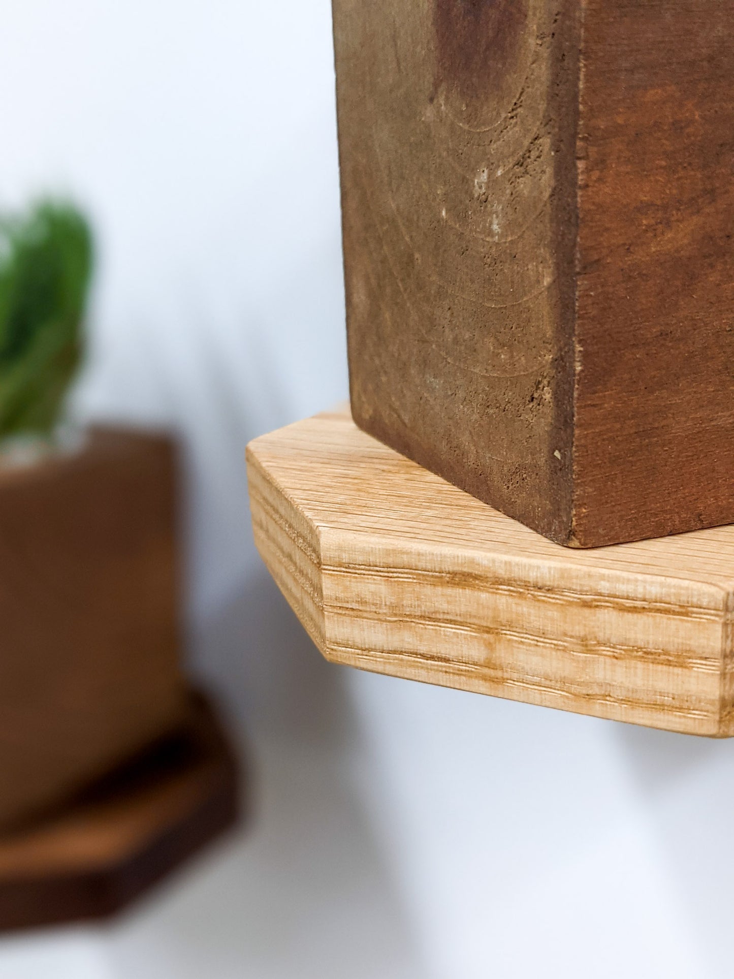 A close-up of the soft rounded edges of our oak octagon floating shelf.